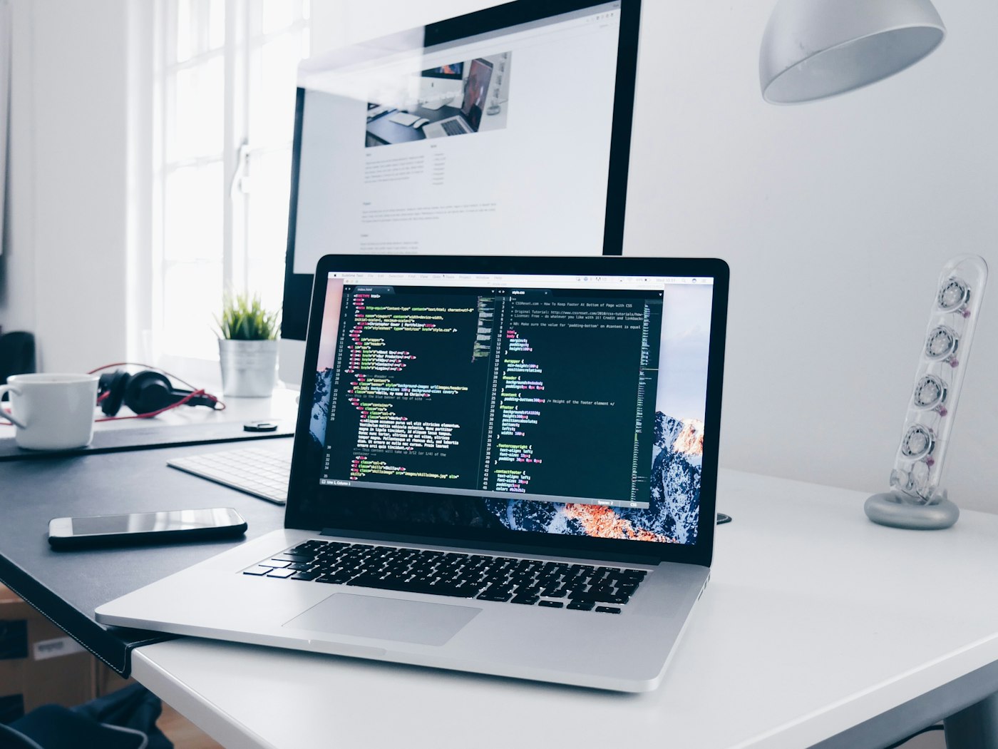 Developer building a web platform at a desk